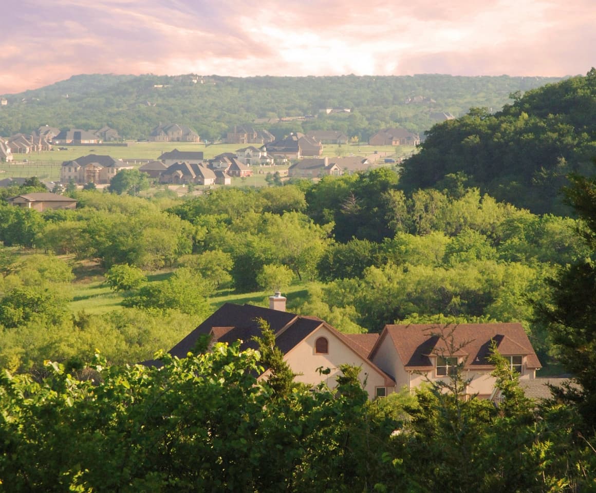 A Southstar community with groves of green trees surrounding the homes.